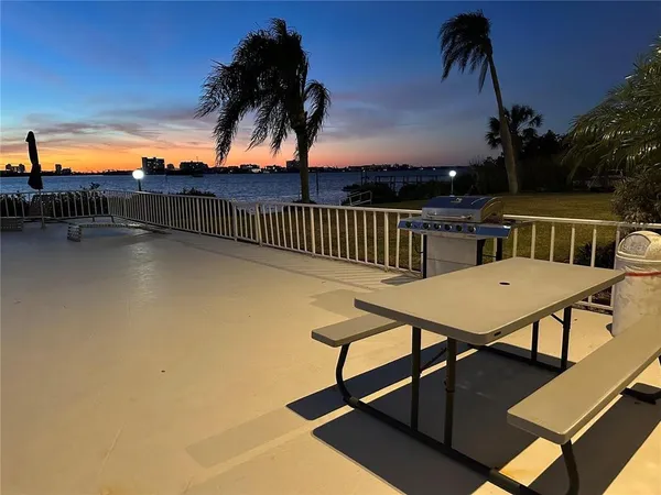 a view of swimming pool with furniture