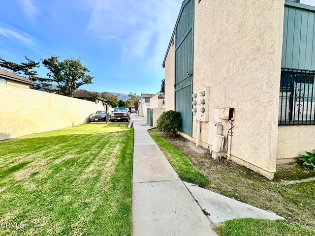 a view of a back yard of the house