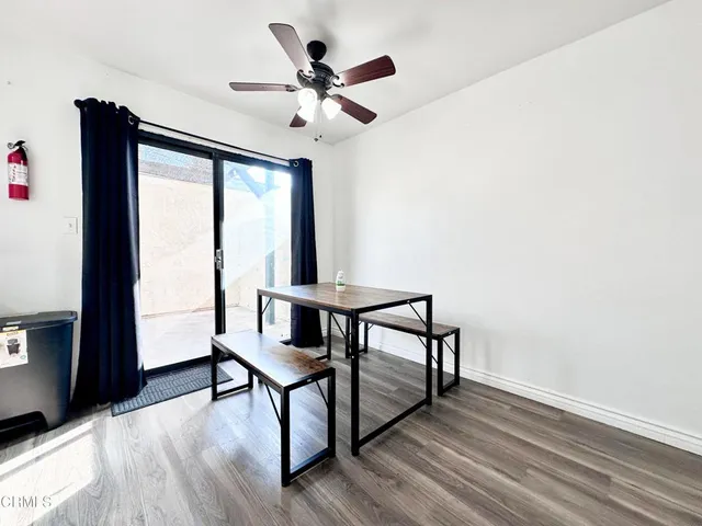 a view of a livingroom with furniture and a window