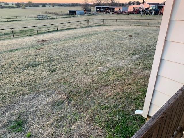 1001 Fortenberry Road Decatur, TX 76234 - Photo 12 of 15 a view of a yard with wooden fence