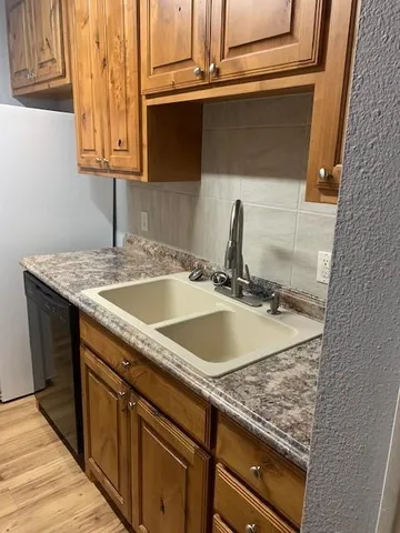 a sink with granite countertop a sink and vanity