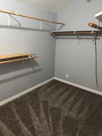 a view of a room with racks on the wall