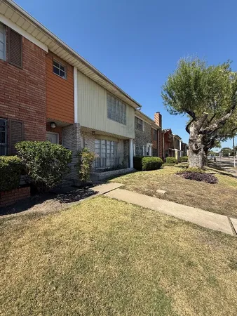 a view of large house with a yard