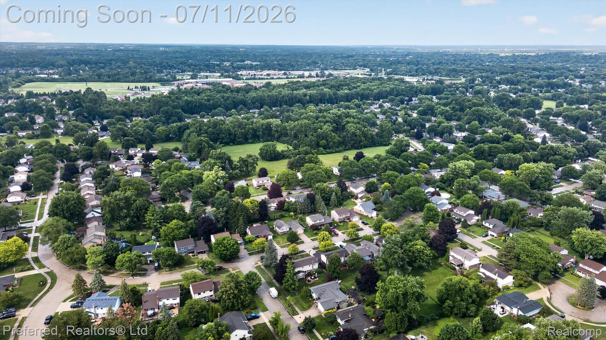 46596 Maidstone Road Canton, MI 48187 - Photo 58 of 61 Expansive residential neighborhood featuring numerous mature trees, paved streets, and a mix of single-family residences