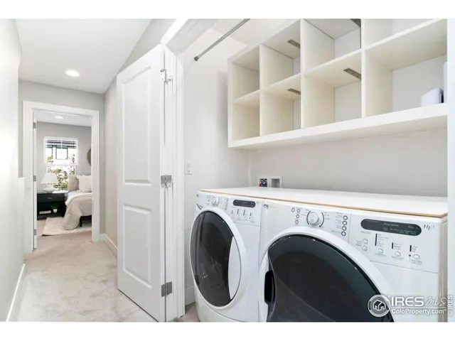 a view of livingroom with washer and dryer