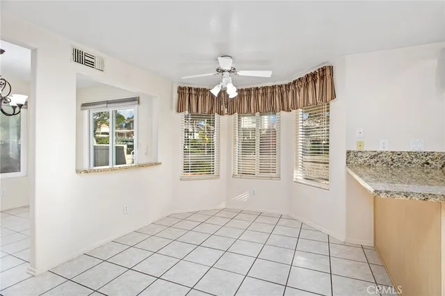a kitchen with granite countertop cabinets stainless steel appliances and a sink