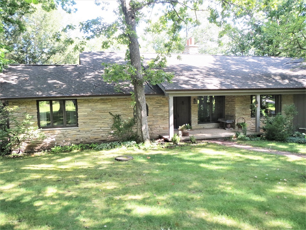 878 Riverside Drive Dixon, IL 61021 - Photo 1 of 45 a backyard of a house with yard table and chairs
