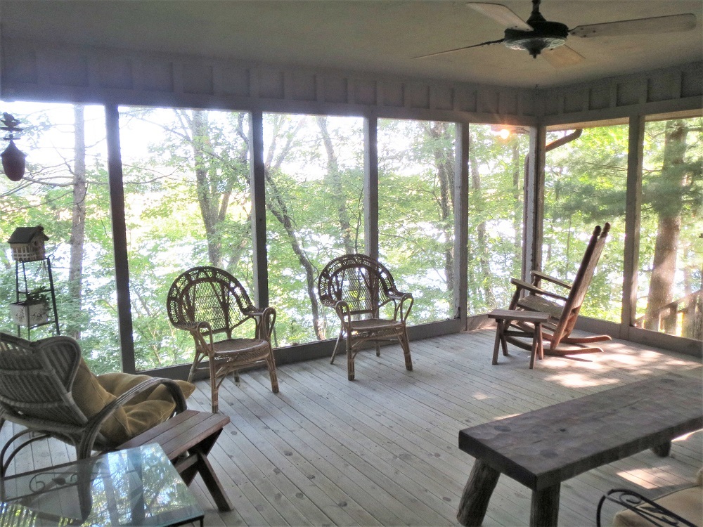878 Riverside Drive Dixon, IL 61021 - Photo 34 of 45 a living room with furniture and a floor to ceiling window