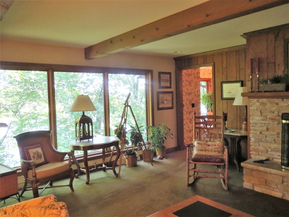 878 Riverside Drive Dixon, IL 61021 - Photo 7 of 45 a living room with fireplace furniture and a large window