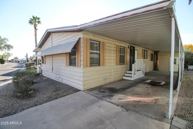 a view of a porch with wooden floor and a window