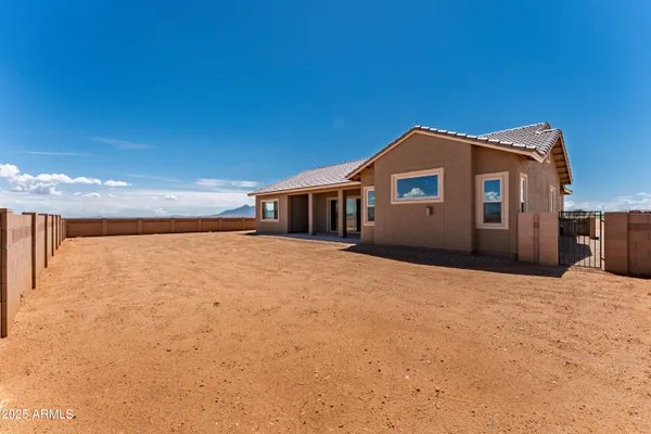 a large white bed with a large mountain