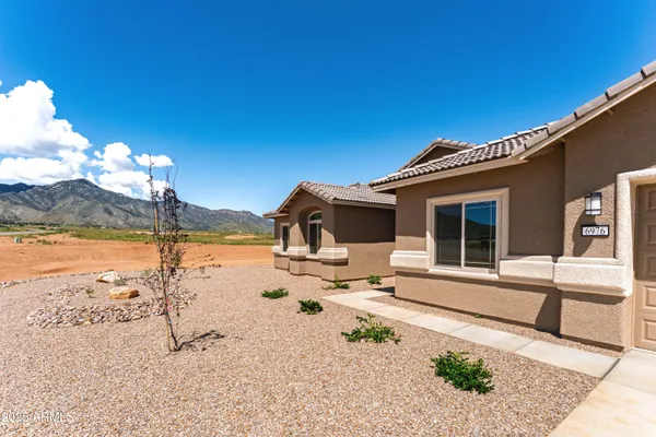 a front view of a house with ocean view