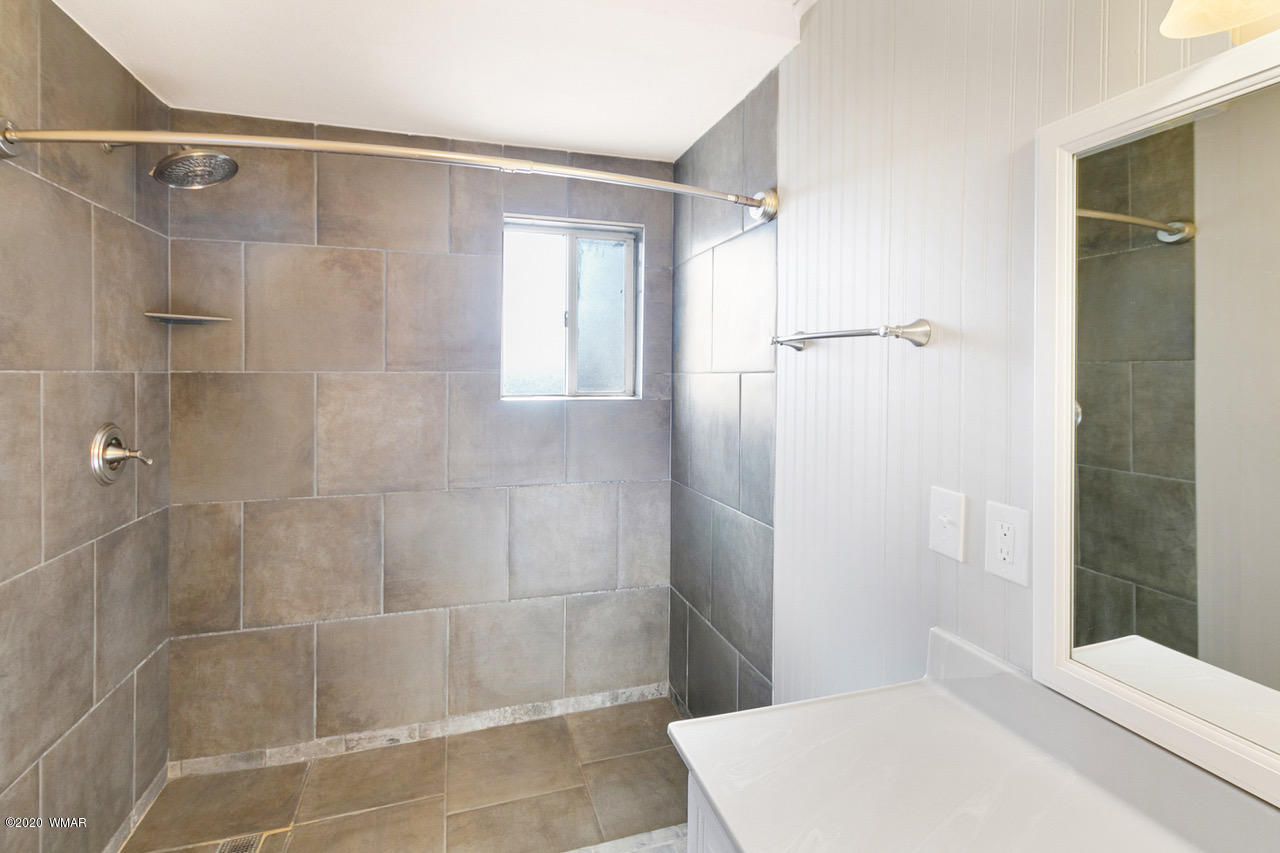 205 North 4th W Street Snowflake, AZ 85937 - Photo 14 of 24 a bathroom with a shower and a toilet