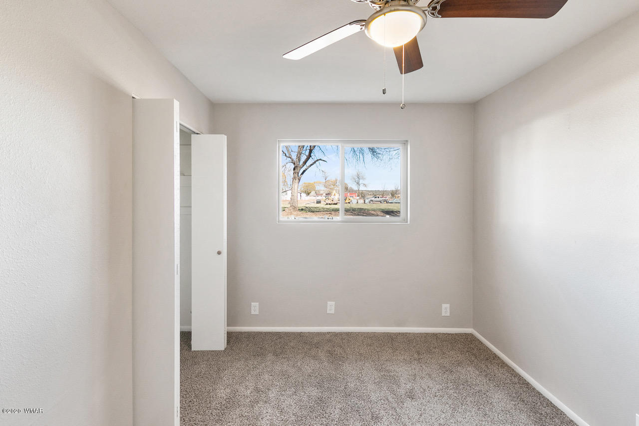 205 North 4th W Street Snowflake, AZ 85937 - Photo 15 of 24 an empty room with windows and cabinet