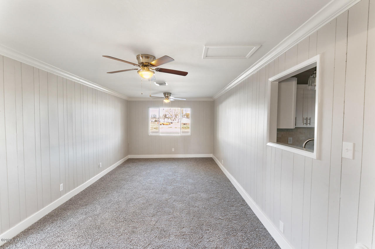 205 North 4th W Street Snowflake, AZ 85937 - Photo 4 of 24 an empty room with windows and fan