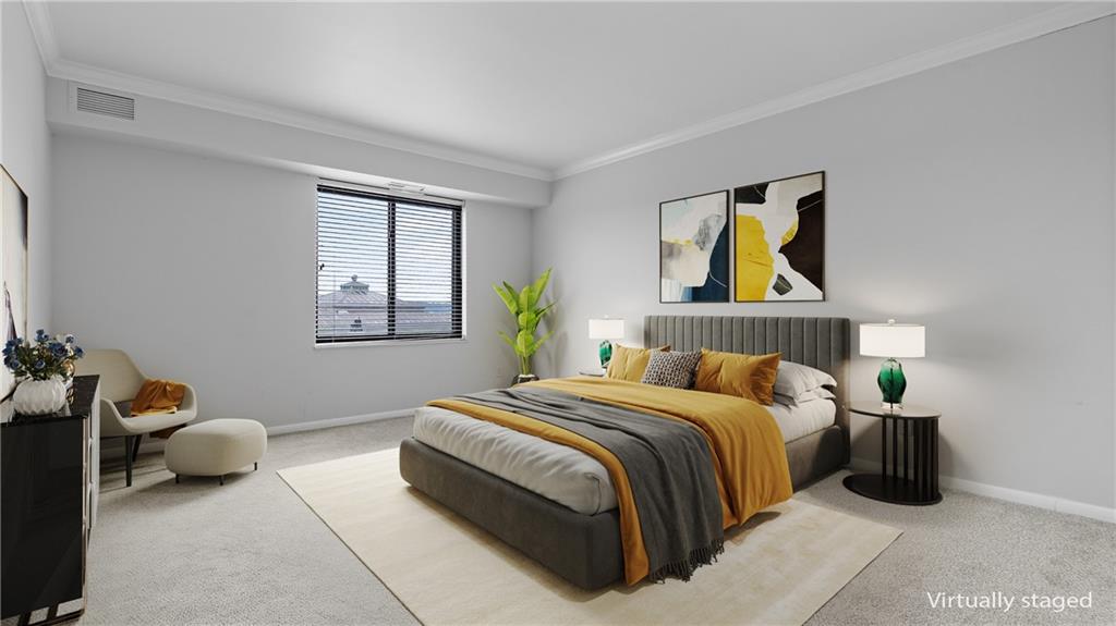 307 South Dithridge Street, Unit 810 Pittsburgh, PA 15213 - Photo 14 of 26 a bedroom with a bed and a couch