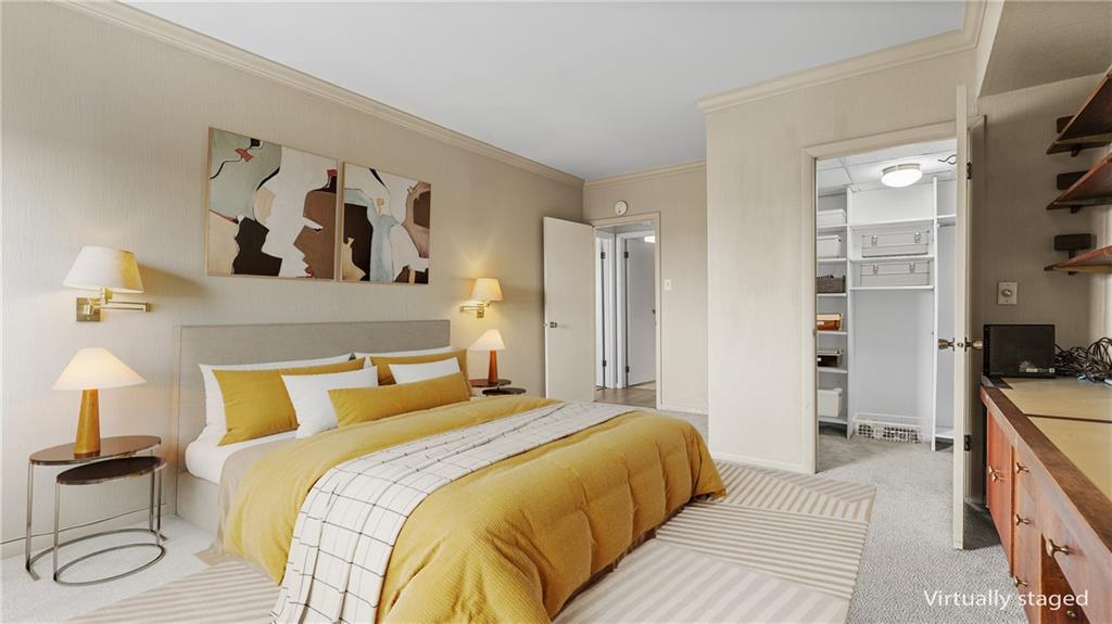 307 South Dithridge Street, Unit 810 Pittsburgh, PA 15213 - Photo 19 of 26 a bedroom with a bed and a book shelf