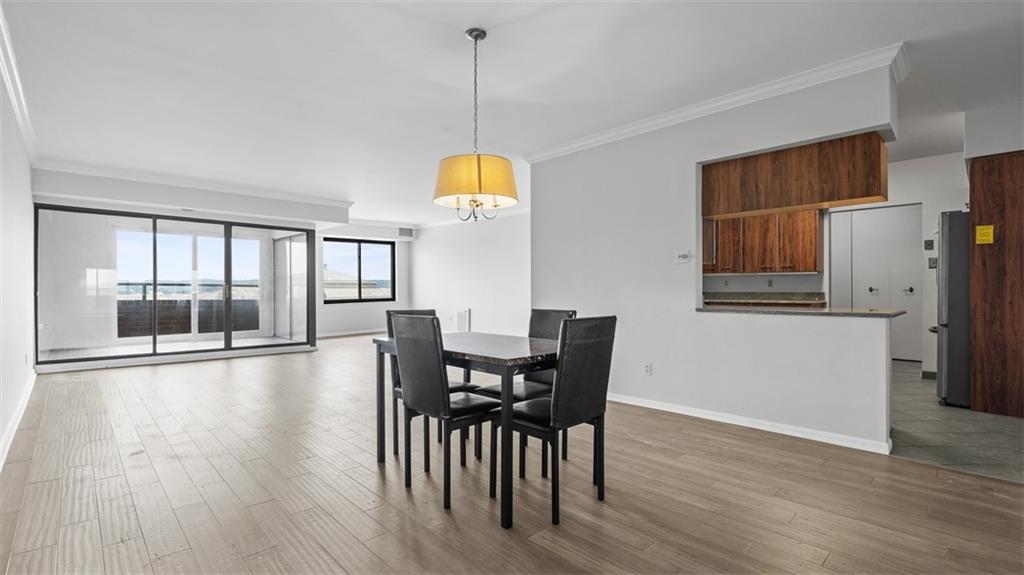 307 South Dithridge Street, Unit 810 Pittsburgh, PA 15213 - Photo 8 of 26 a view of a dining room with furniture and wooden floor
