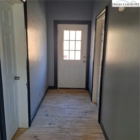 a bedroom with a bed and a bookshelf