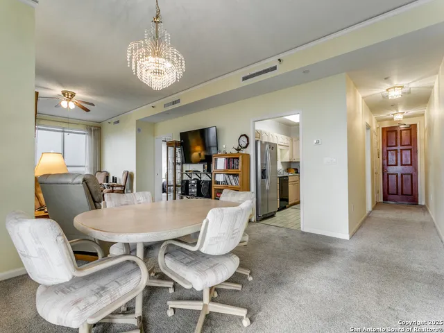 a view of a dining room with furniture