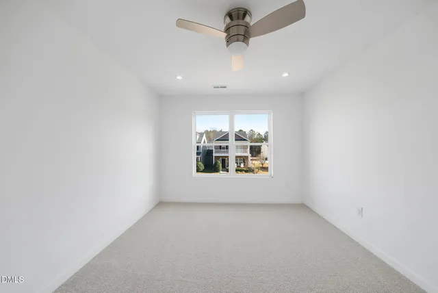 an empty room with a empty space and a window