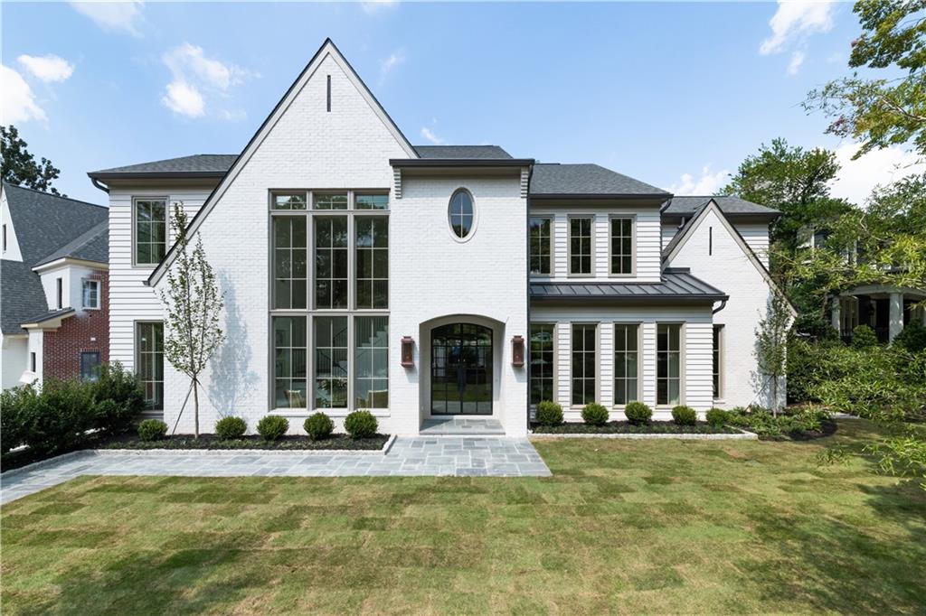 299 The Prado Northeast Atlanta, GA 30309 - Photo 1 of 58 a front view of a house with a yard