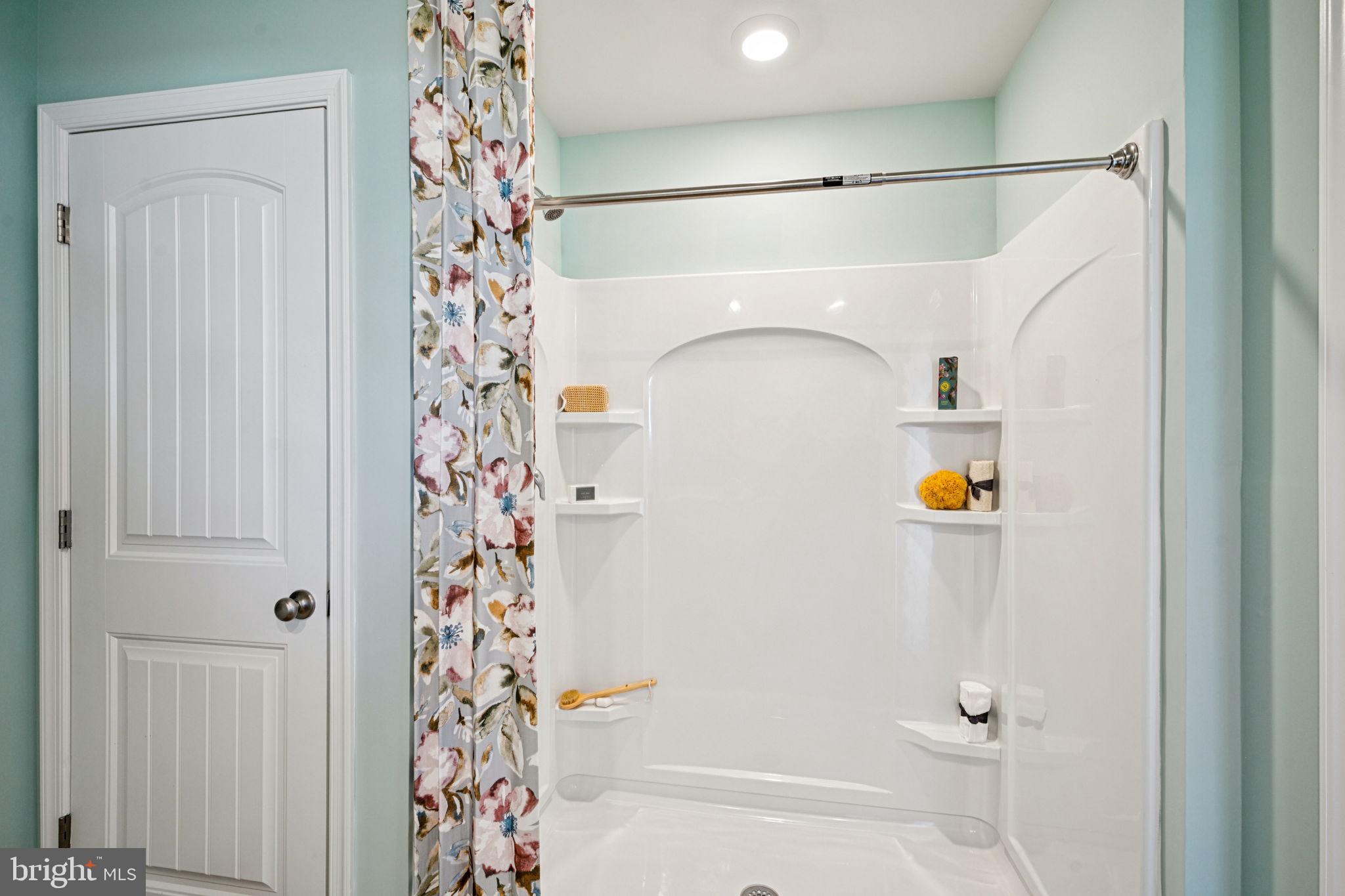 1153 Wintermead Loop Salisbury, MD 21801 - Photo 26 of 33 a bathroom with a shower curtain and a shower curtain