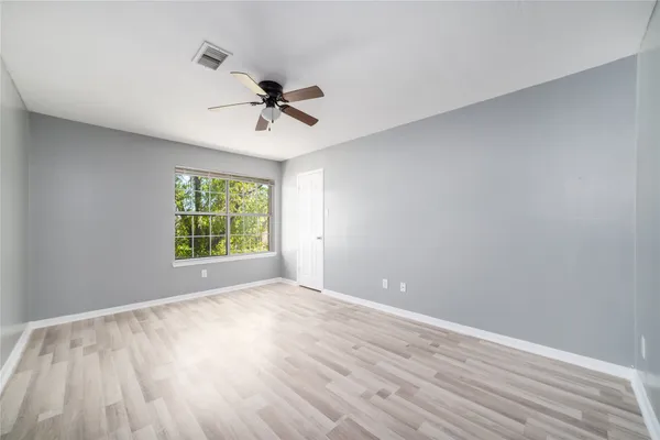 a view of room with hardwood floor and window