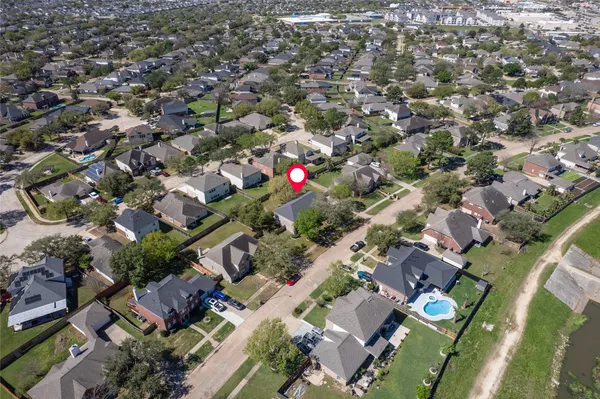 an aerial view of residential houses with outdoor space