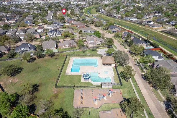 an aerial view of residential houses with outdoor space
