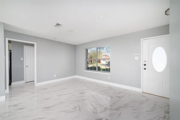 a view of an empty room with a window