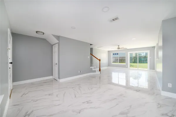 a view of an empty room with a window