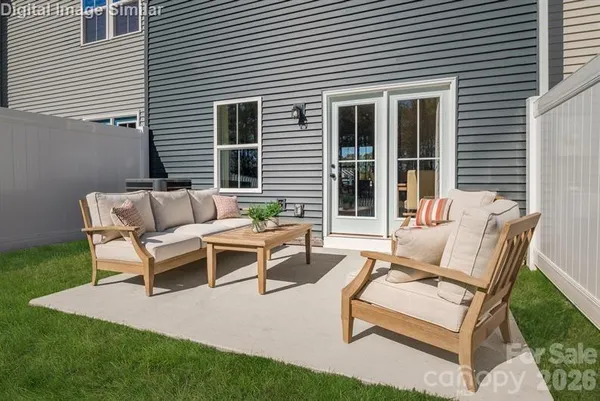 a view of a backyard with furniture