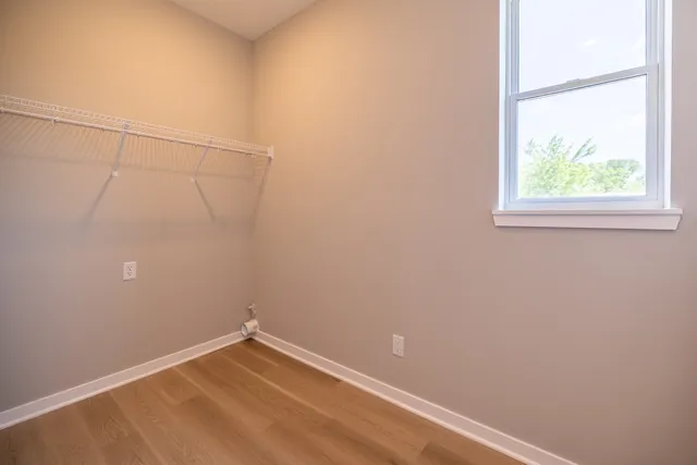 a bathroom with a tub and shower