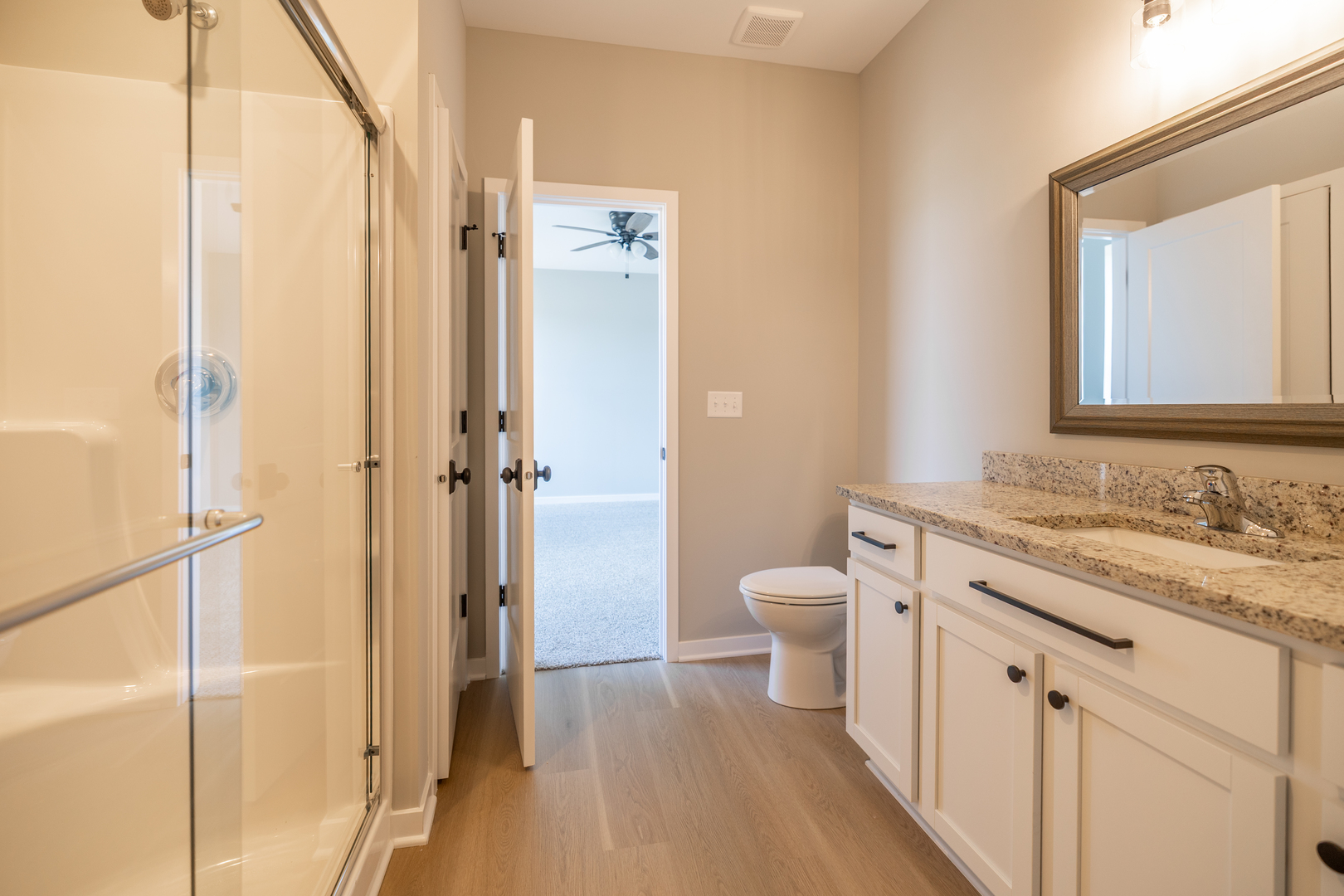 12 Redbud Row Ottawa, IL 61350 - Photo 27 of 39 a bathroom with a granite countertop sink toilet and shower