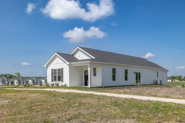 a view of a house with a yard