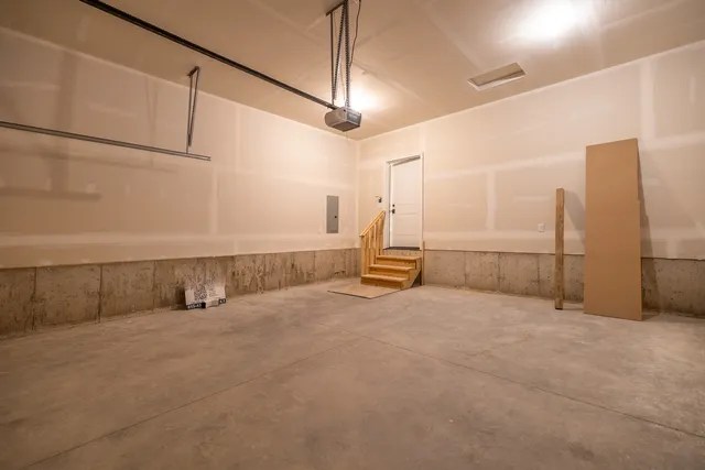 a view of a house with a yard and potted plants