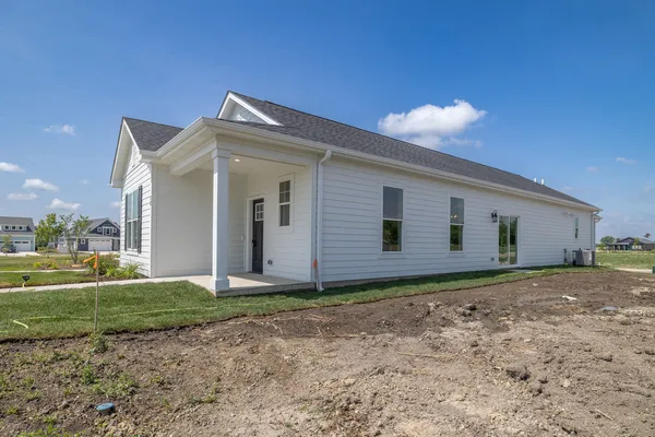 a view of a front of a house with a yard