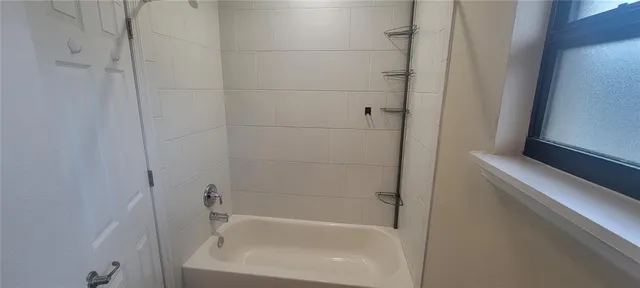 a close view of a bathtub in bathroom