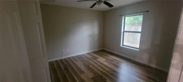 a view of an empty room and a window