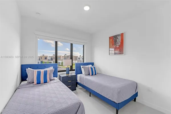 a bedroom with a large bed and a couch