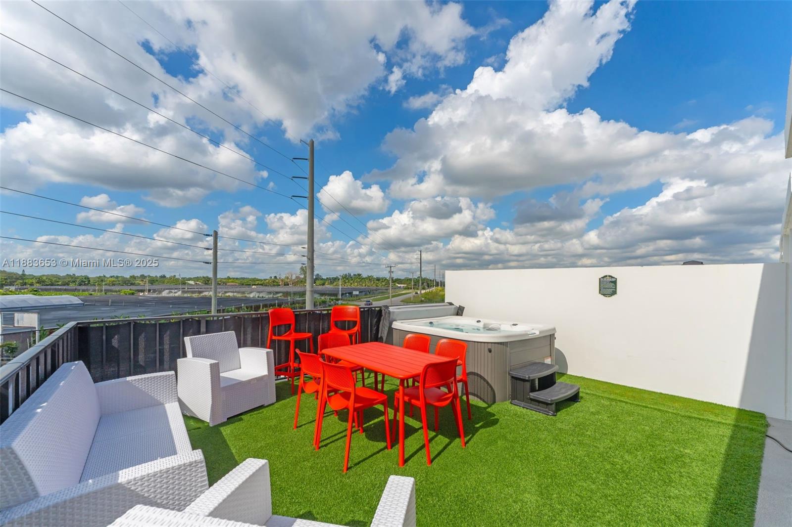 26144 Southwest 146th Court Homestead, FL 33032 - Photo 22 of 35 a view of a terrace with furniture