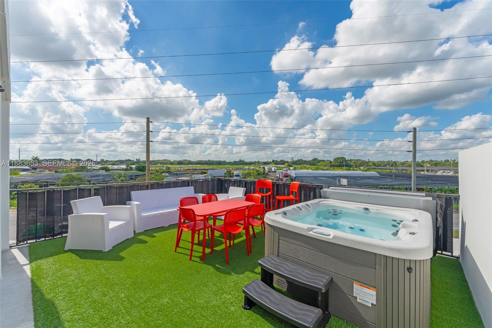 26144 Southwest 146th Court Homestead, FL 33032 - Photo 23 of 35 Spacious rooftop with jacuzzi, bar, and lounge area, perfect for entertaining.