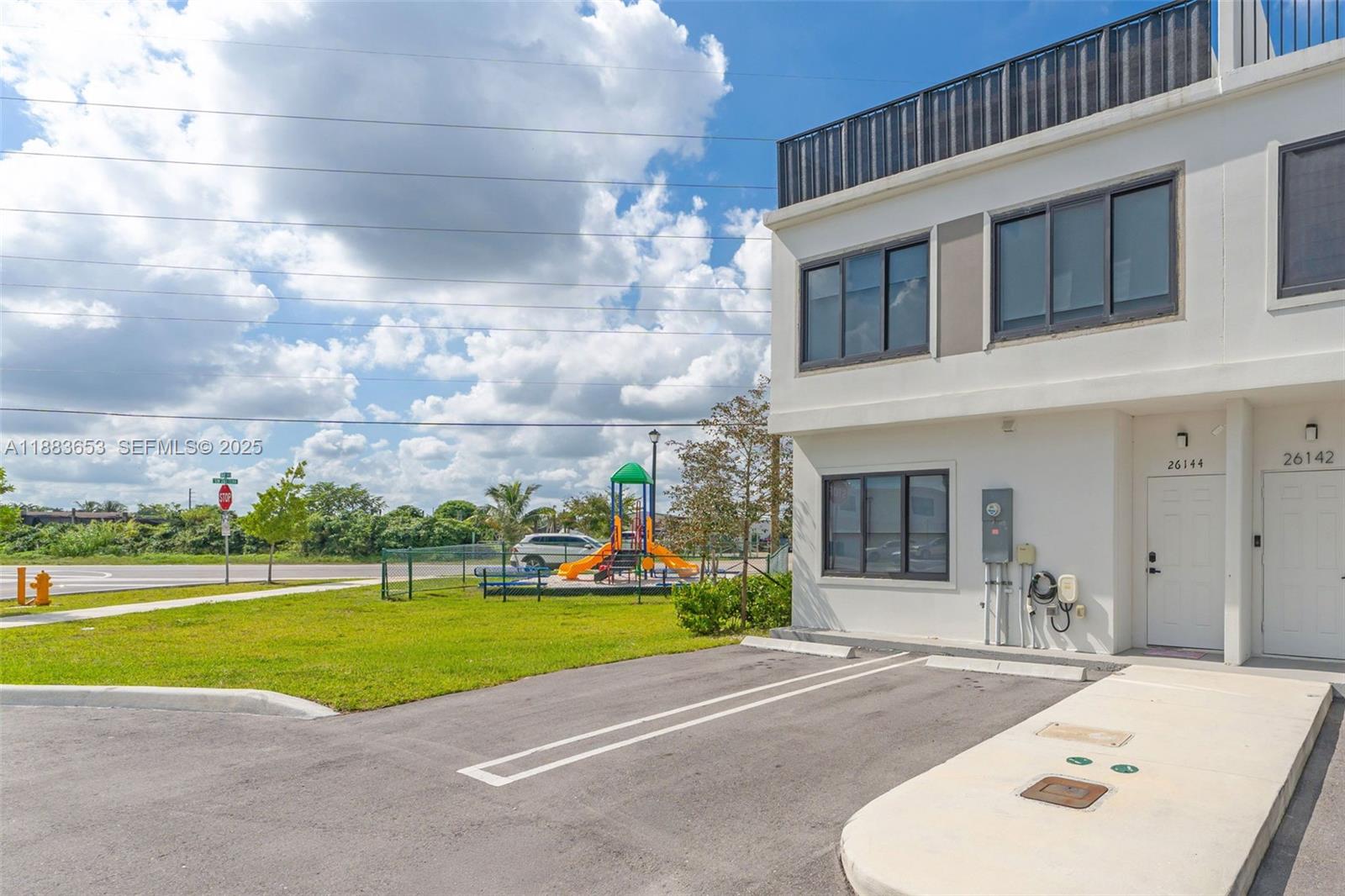 26144 Southwest 146th Court Homestead, FL 33032 - Photo 3 of 35 Secondary entrance with easy access from parking, perfect for bringing in groceries or packages.