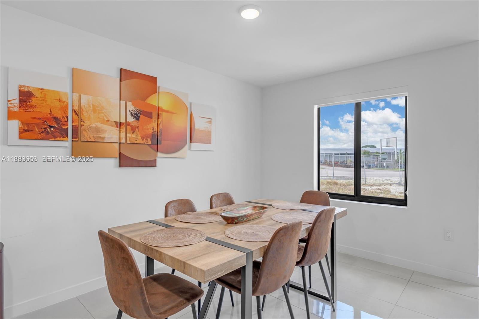 26144 Southwest 146th Court Homestead, FL 33032 - Photo 8 of 35 Cozy dining space with natural light and modern décor.
