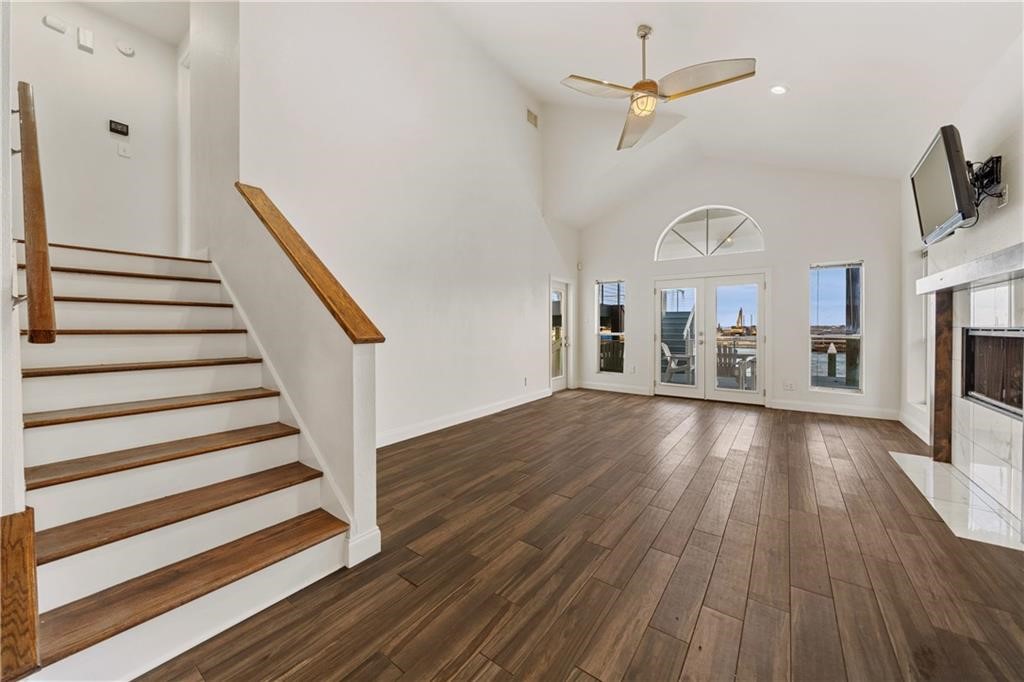 741 Snug Corpus Christi, TX 78402 - Photo 15 of 40 a view of a livingroom with wooden floor and a ceiling fan