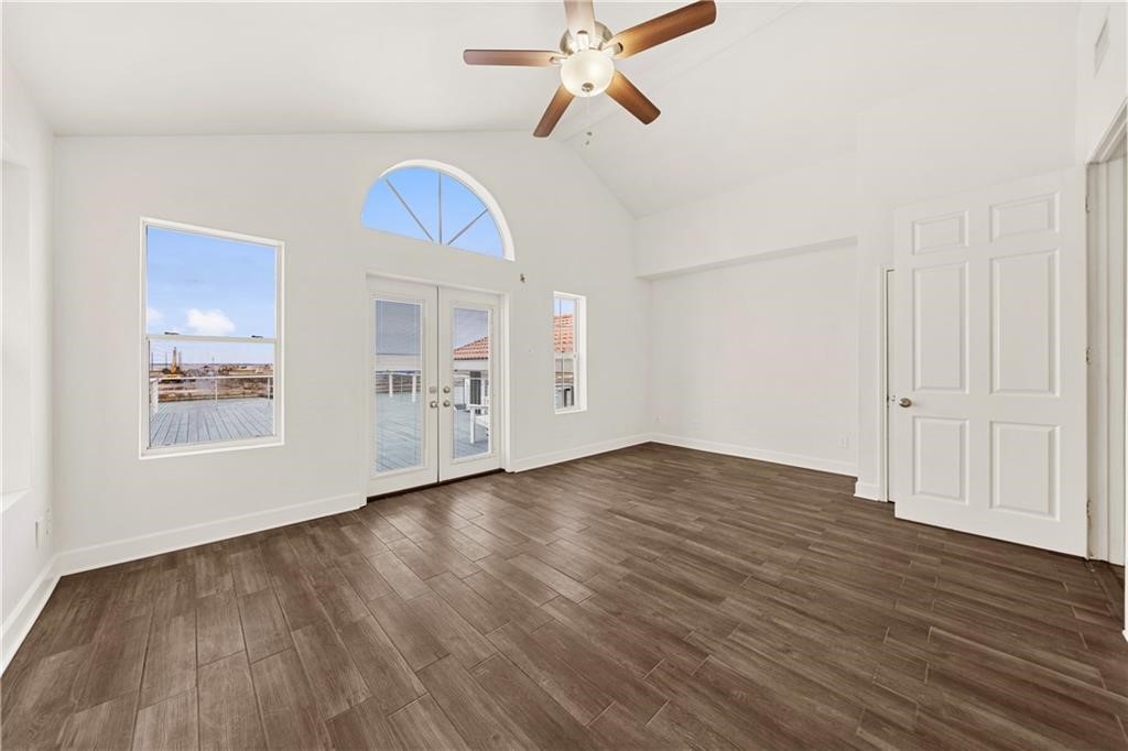 741 Snug Corpus Christi, TX 78402 - Photo 16 of 40 wooden floor in an empty room with a window