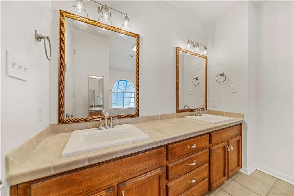 741 Snug Corpus Christi, TX 78402 - Photo 19 of 40 a bathroom with a sink and a mirror