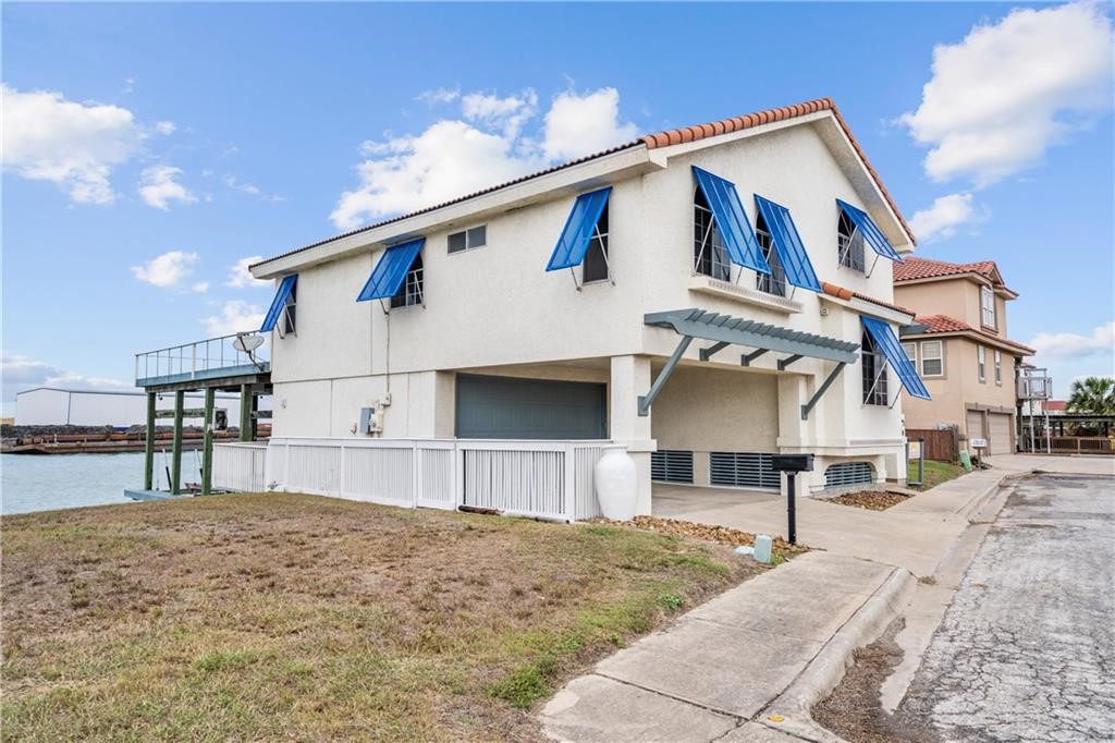 741 Snug Corpus Christi, TX 78402 - Photo 2 of 40 a front view of a house with a yard