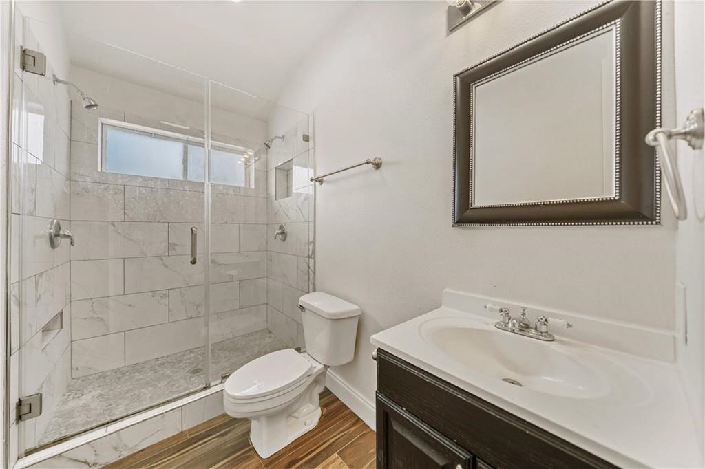 741 Snug Corpus Christi, TX 78402 - Photo 22 of 40 a bathroom with a sink toilet and shower